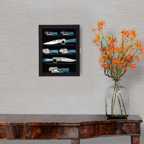 Grintus pocket knife display UV acrylic panel demonstrating clarity and protection
