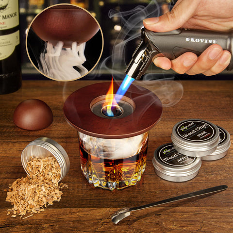 Grovind cocktail smoker torch in use creates rich aroma for Old Fashioned drinks.