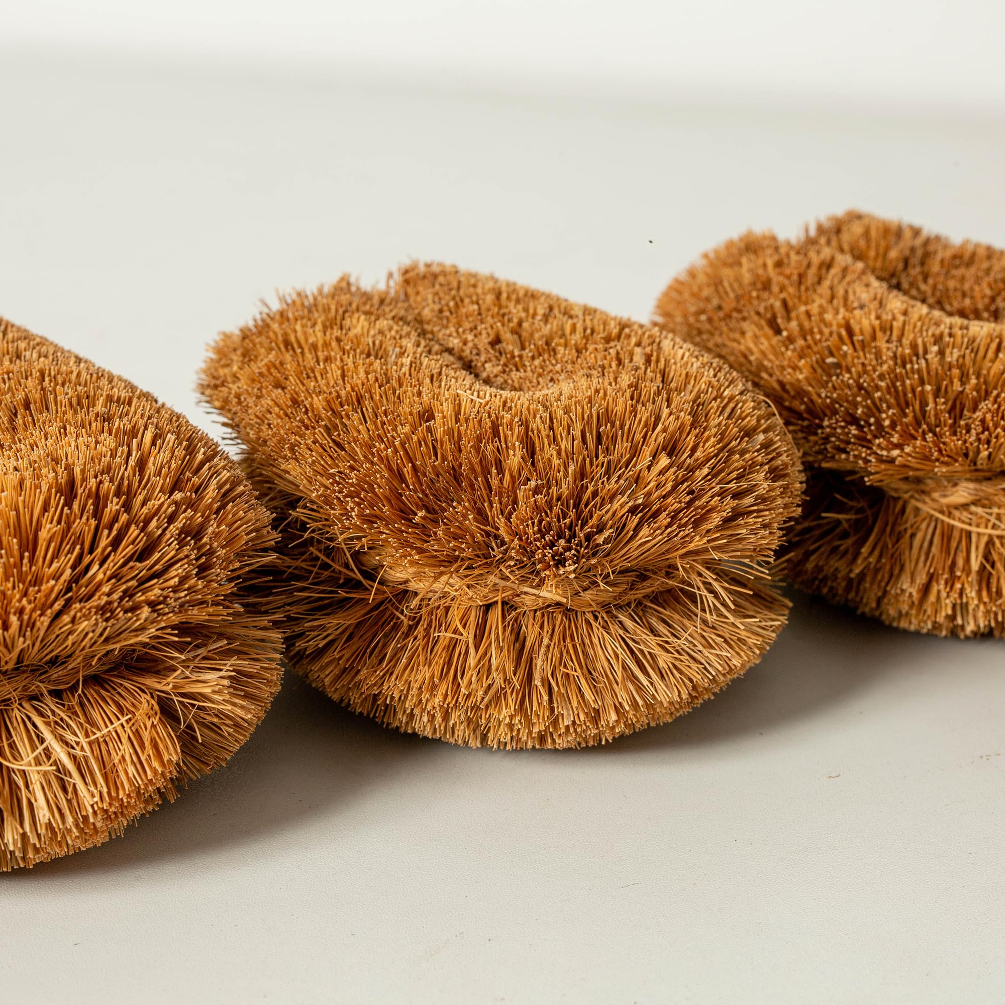 GrowByCoco Tawashi coconut coir bristles tackle tough residue on cookware.