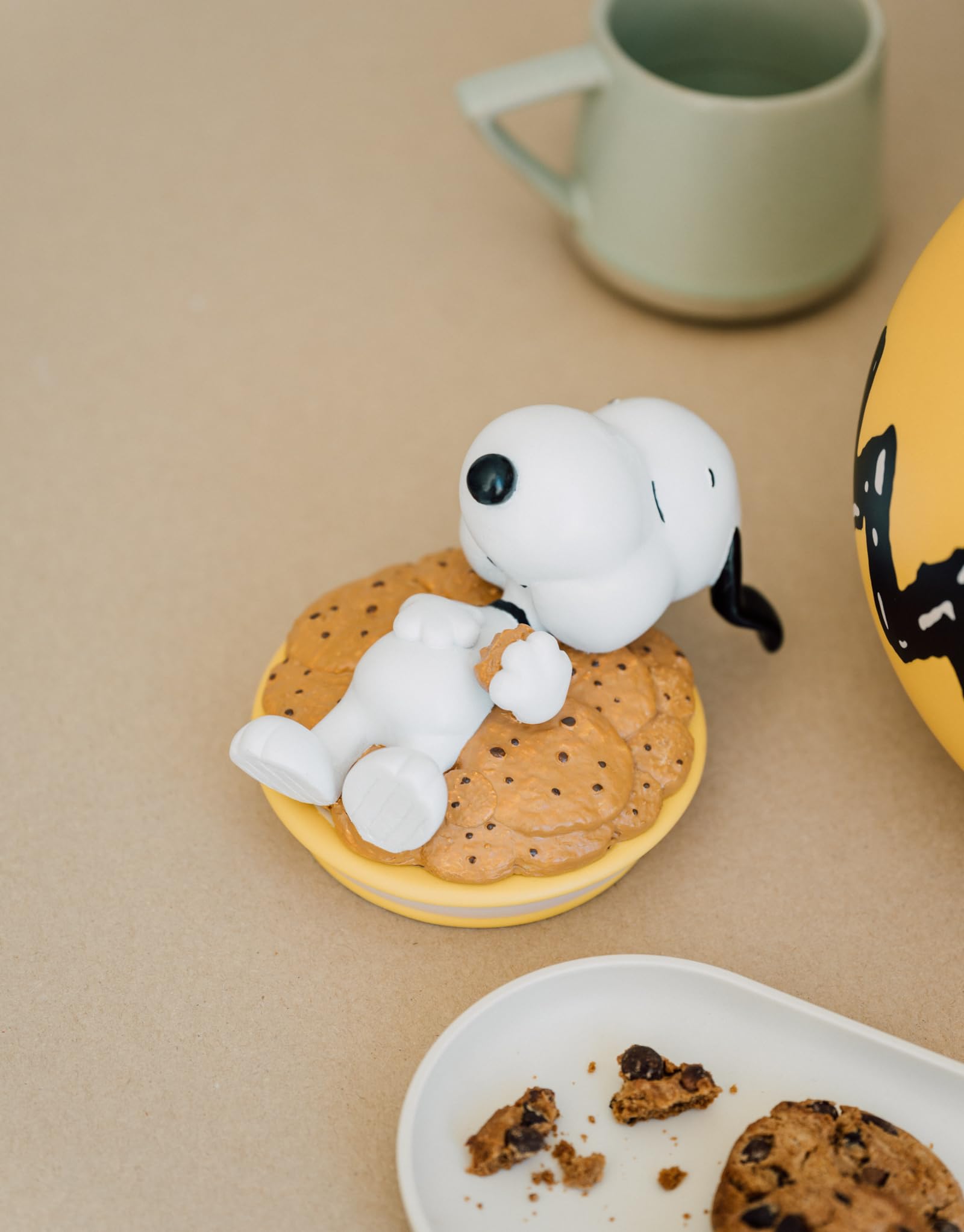 Yellow Snoopy jar brightens counter while storing cookies securely.