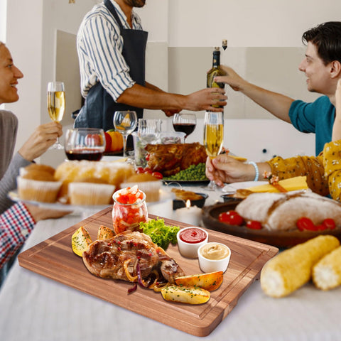 Gtencemen Acacia cutting board serves as charcuterie or serving tray.