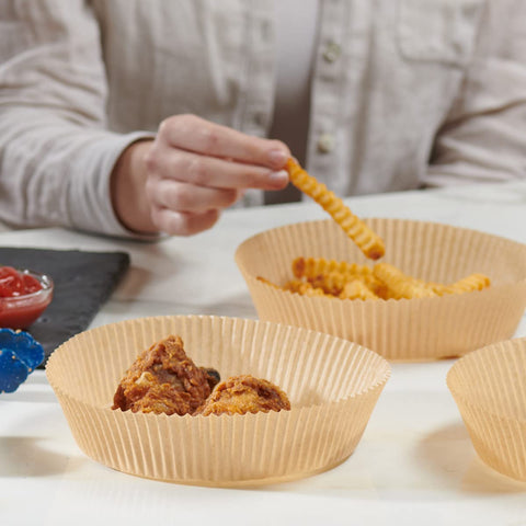 GUSTO liners in use inside an air fryer for frying and baking