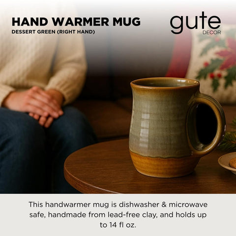 GUTE hand warmer mug held in the right hand enhances chilly mornings.