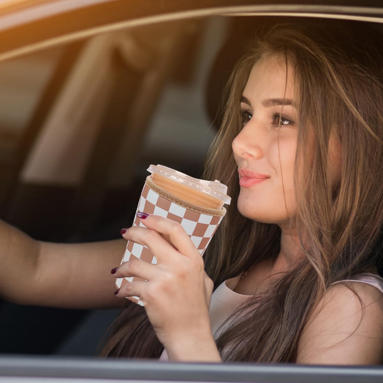 Haevola Checkered Delight sleeve set on iced coffee for a stylish, grippy hold
