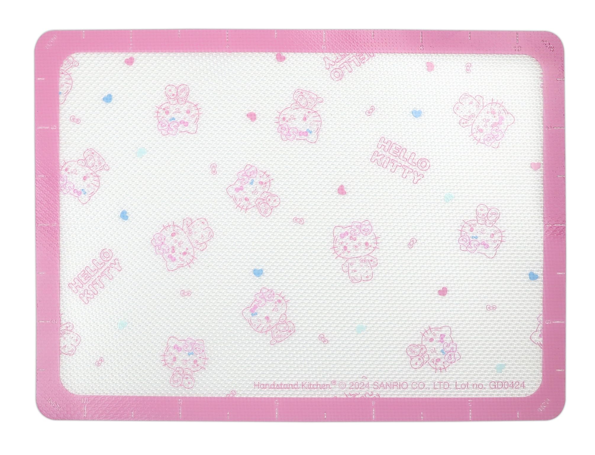 Handstand Kitchen 50th anniversary pink baking sheet close-up highlights sturdy carbon steel.