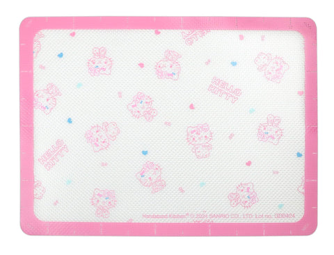Handstand Kitchen 50th anniversary pink baking sheet close-up highlights sturdy carbon steel.