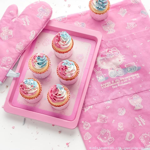 Lifestyle shot with Hello Kitty cookies demonstrates kid-friendly baking with Handstand Kitchen tools.