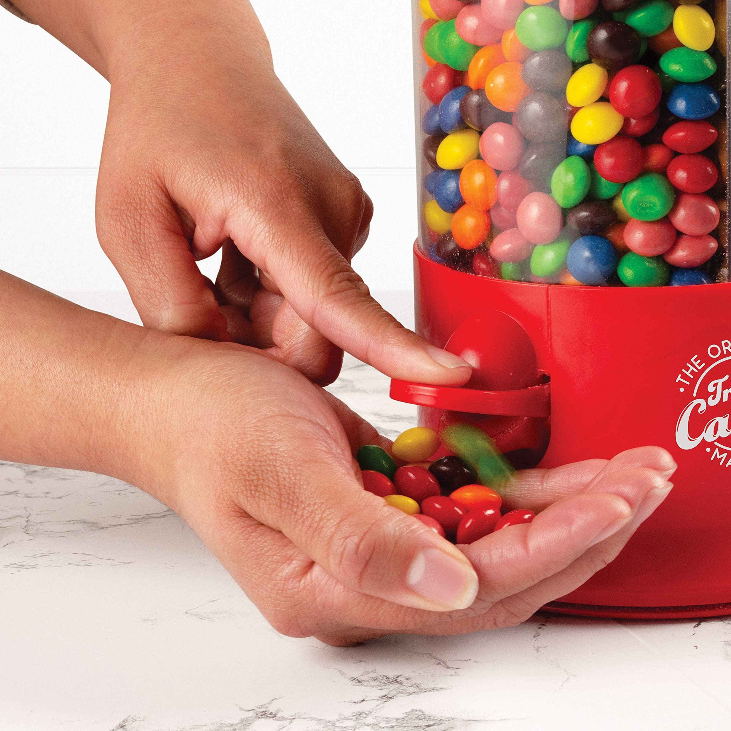 Handy Gourmet triple candy machine demonstrates three-compartment setup for mixed snacks.