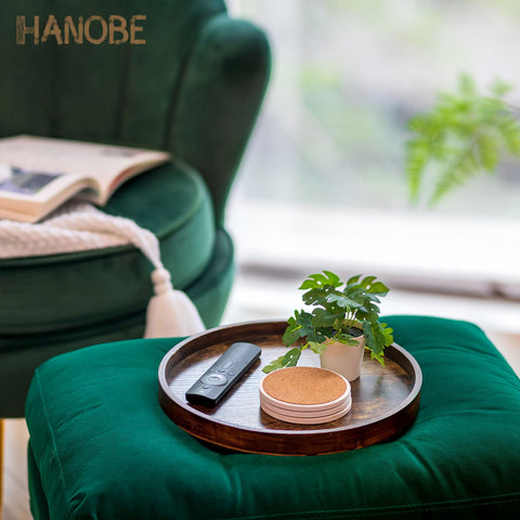 Hanobe 12-inch circle tray with candle holder creates cozy table ambiance.