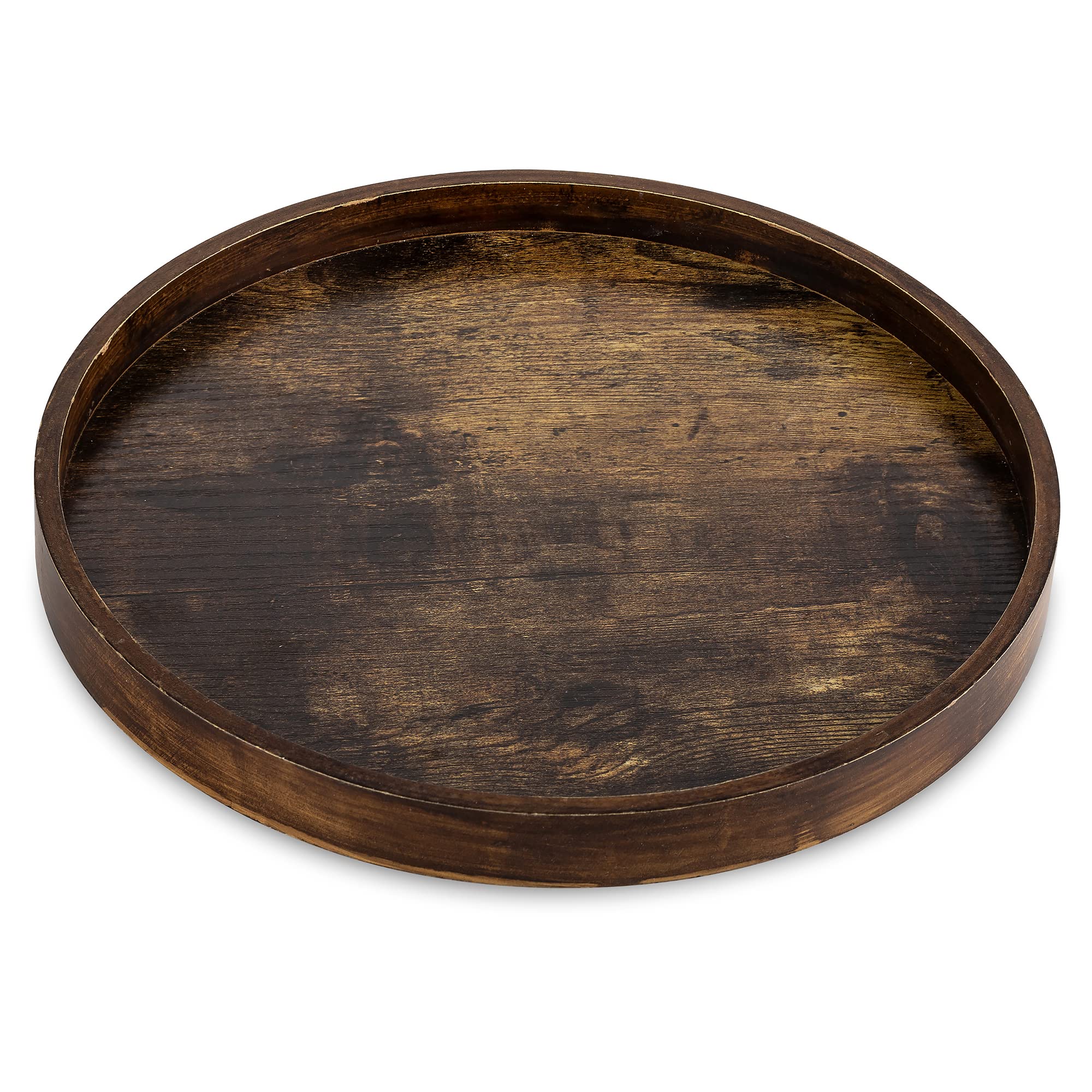 Hanobe round brown decorative tray on coffee table organizes remotes and snacks.