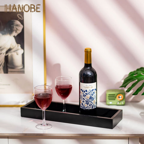 Hanobe-ottoman-storage-tray organizes remotes, snacks, and small items.