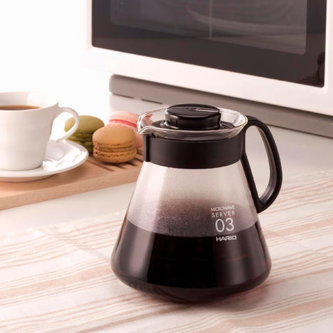 V60 glass range coffee server in a modern kitchen setting