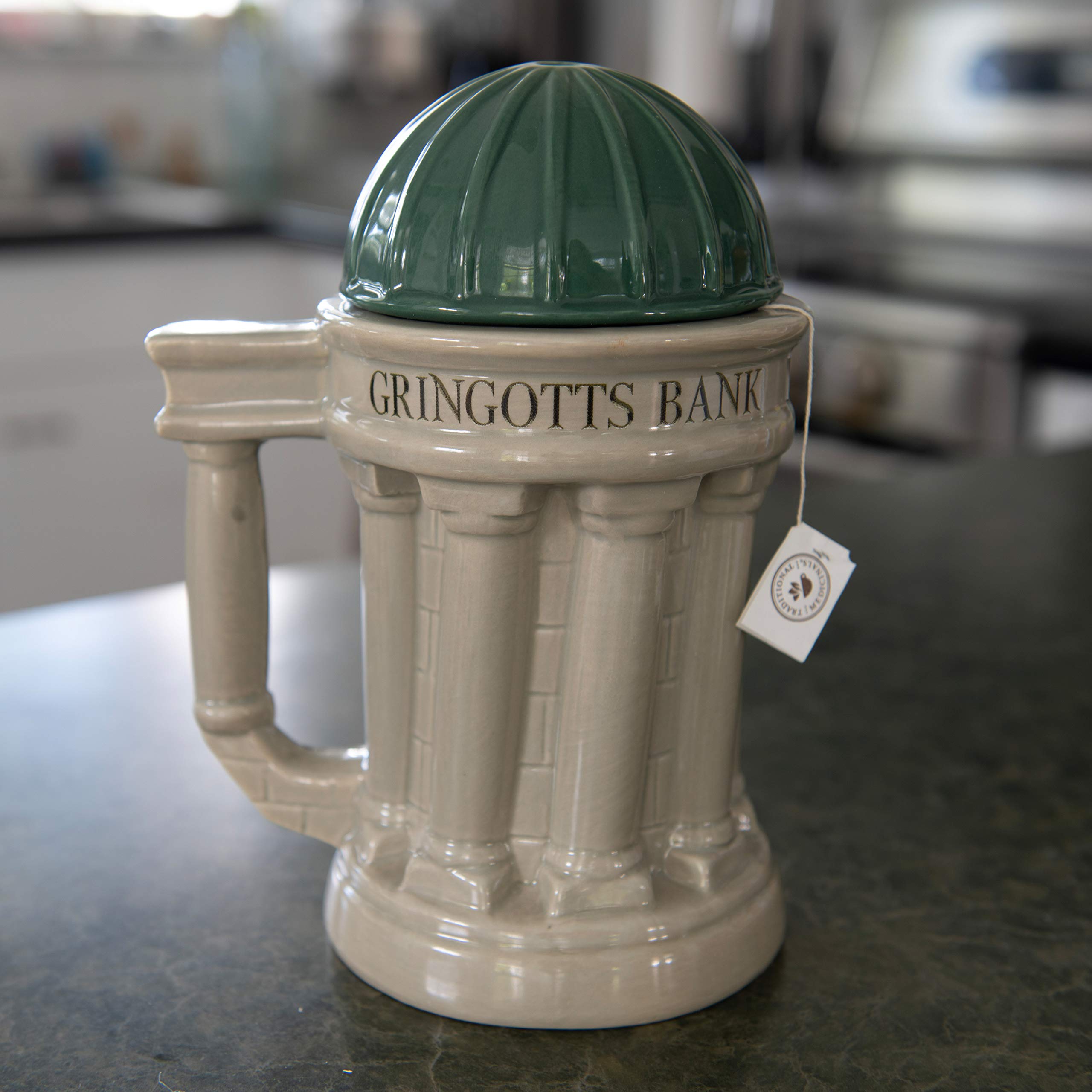 Gringotts mug shown at a Harry Potter themed party setup.