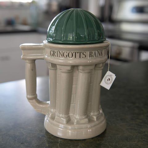 Gringotts mug shown at a Harry Potter themed party setup.