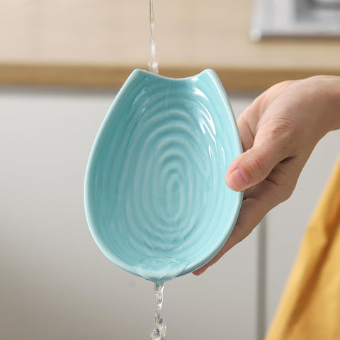 HASENSE teal spoon rest on counter serves as a chic kitchen accessory.