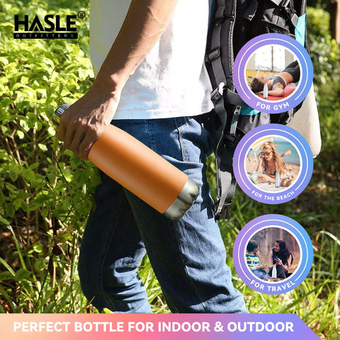 HASLE OUTFITTERS 17oz orange bottle hiking use demonstrates outdoor durability.