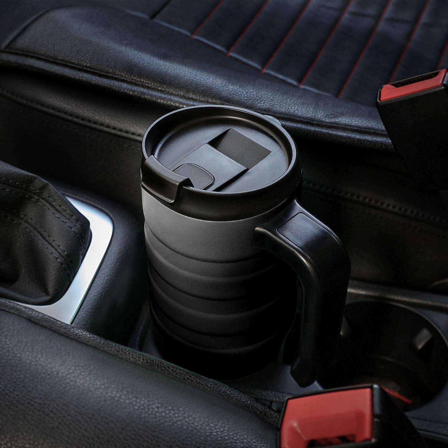 HAUSHOF travel mug fits most car cup holders for convenient transport.