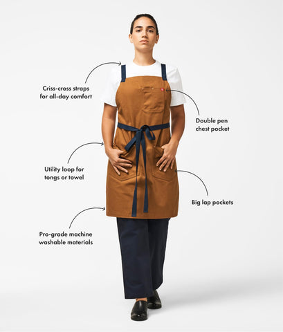 Hedley & Bennett crossback apron shows full front coverage while allowing easy movement.