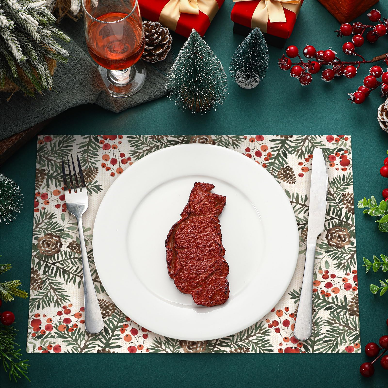 Heentan placemat featuring needle branch and red berries accents to elevate holiday decor.