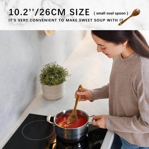 Hefild wooden utensils in pan, offering comfortable grip and control