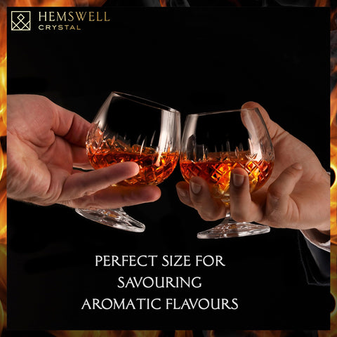 Hemswell Crystal tapered-bowl snifter held in hand, promoting aromatic enjoyment of spirits.