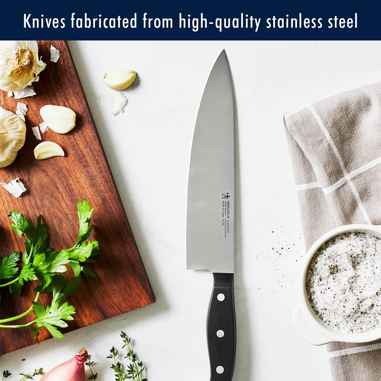 HENCKELS 5-inch serrated utility knife perfect for soft interiors and firm exteriors