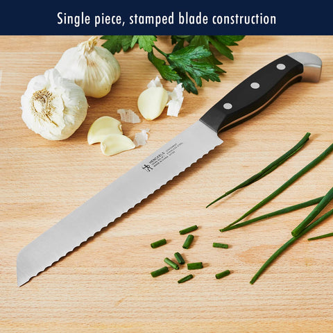 HENCKELS 7-inch hollow-edge Santoku reduces sticking while mincing.