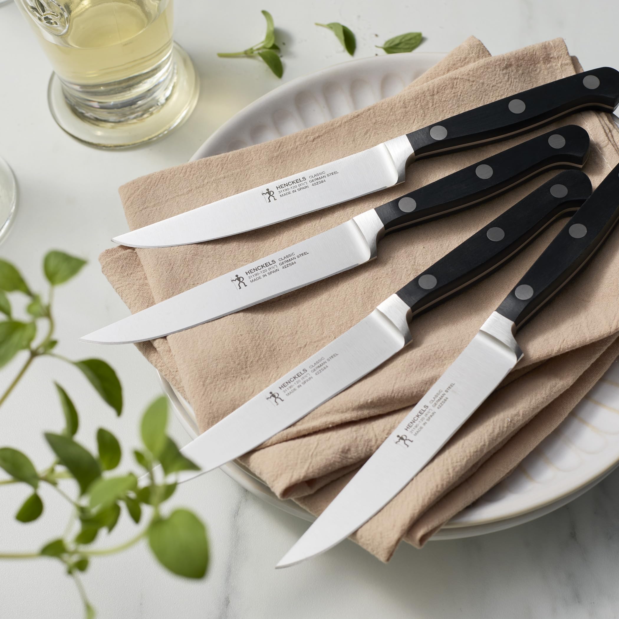 Henckels Classic satin-finish steak knife showing seamless blade-to-handle balance.
