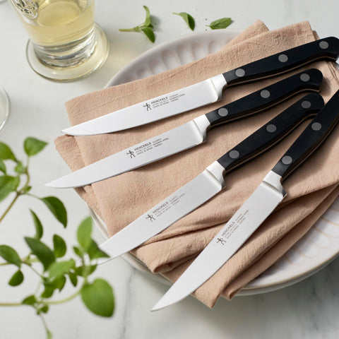 Henckels Classic satin-finish steak knife showing seamless blade-to-handle balance.
