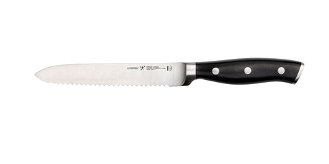 HENCKELS Forged Accent blade close-up highlighting razor-sharp serration for precise cuts.