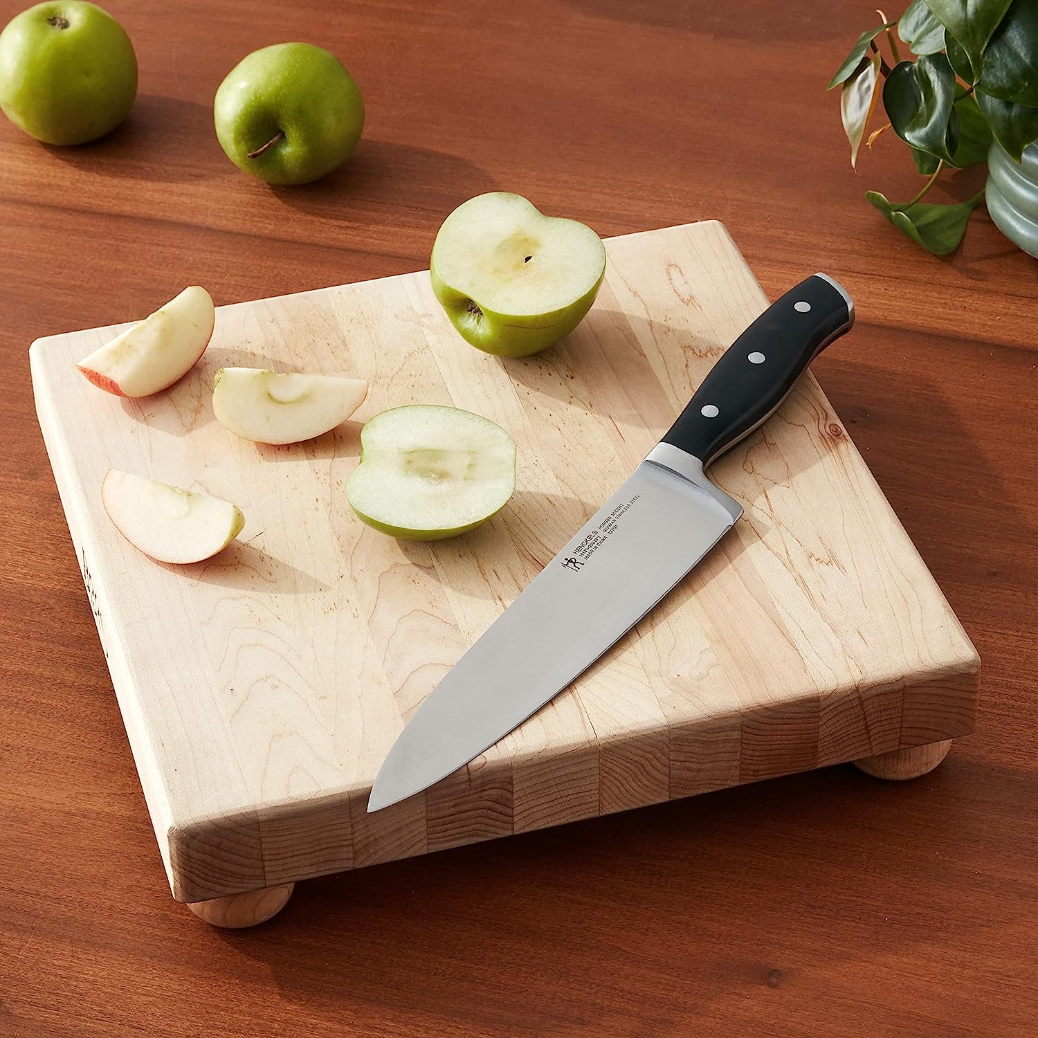 Henckels Forged Accent chef knife full view highlighting balanced design