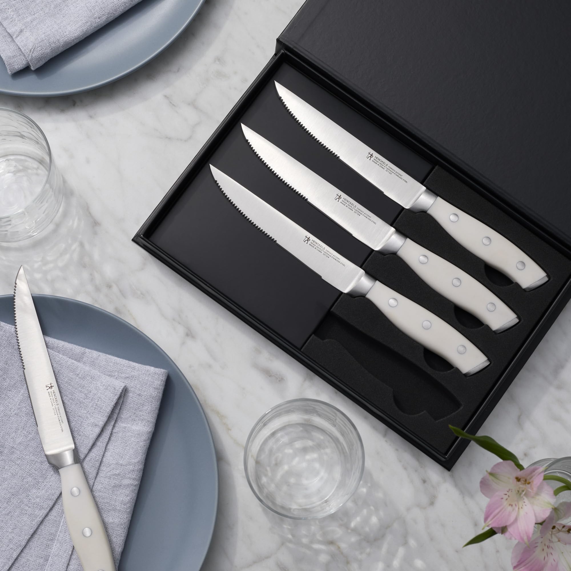 Henckels Forged Accent handle curved with triple rivets for comfortable balance.