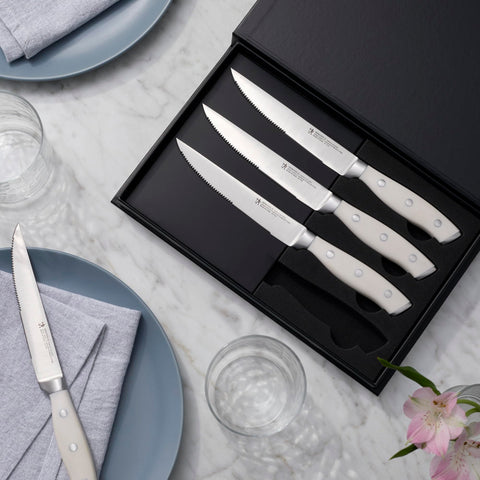 Henckels Forged Accent handle curved with triple rivets for comfortable balance.