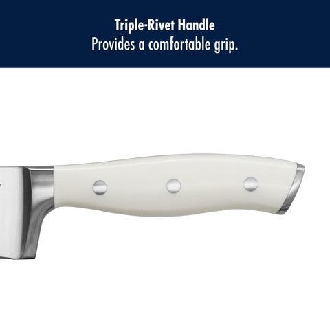 HENCKELS Forged Accent tri-rivet handle shown during chopping herbs