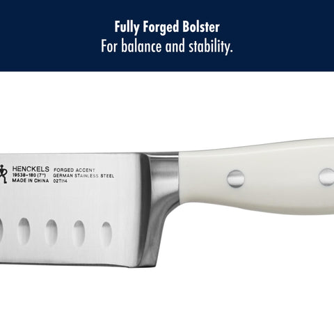 HENCKELS Forged Accent Santoku being used to mince garlic with ease