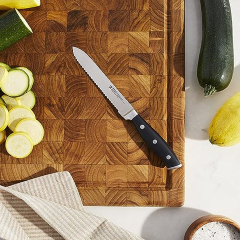 HENCKELS Forged Accent tomato knife for precise tomato slicing.