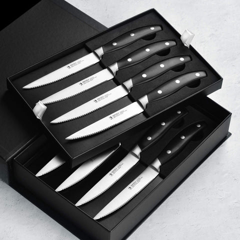 Ergonomic triple-rivet handles on Henckels Forged Contour 8pc set for comfortable grip.
