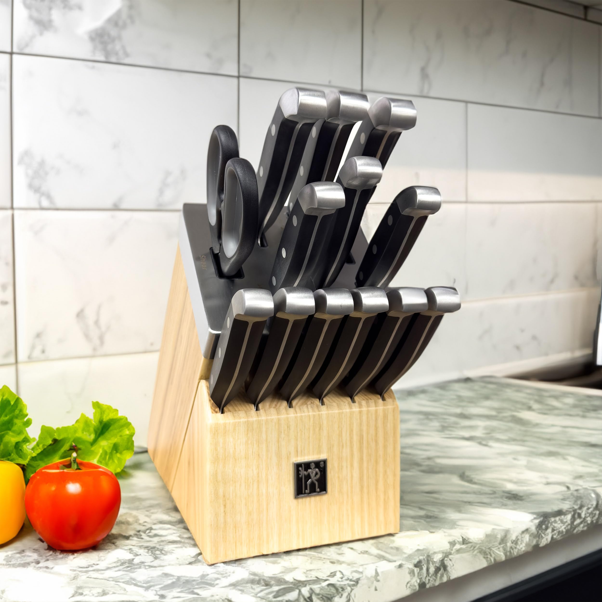 Henckels Statement paring knife close-up for precise fruit prep.
