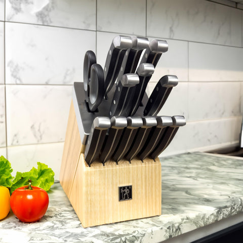 Henckels Statement paring knife close-up for precise fruit prep.