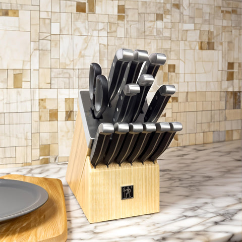 Henckels Statement ergonomic triple-rivet handles provide comfortable control.