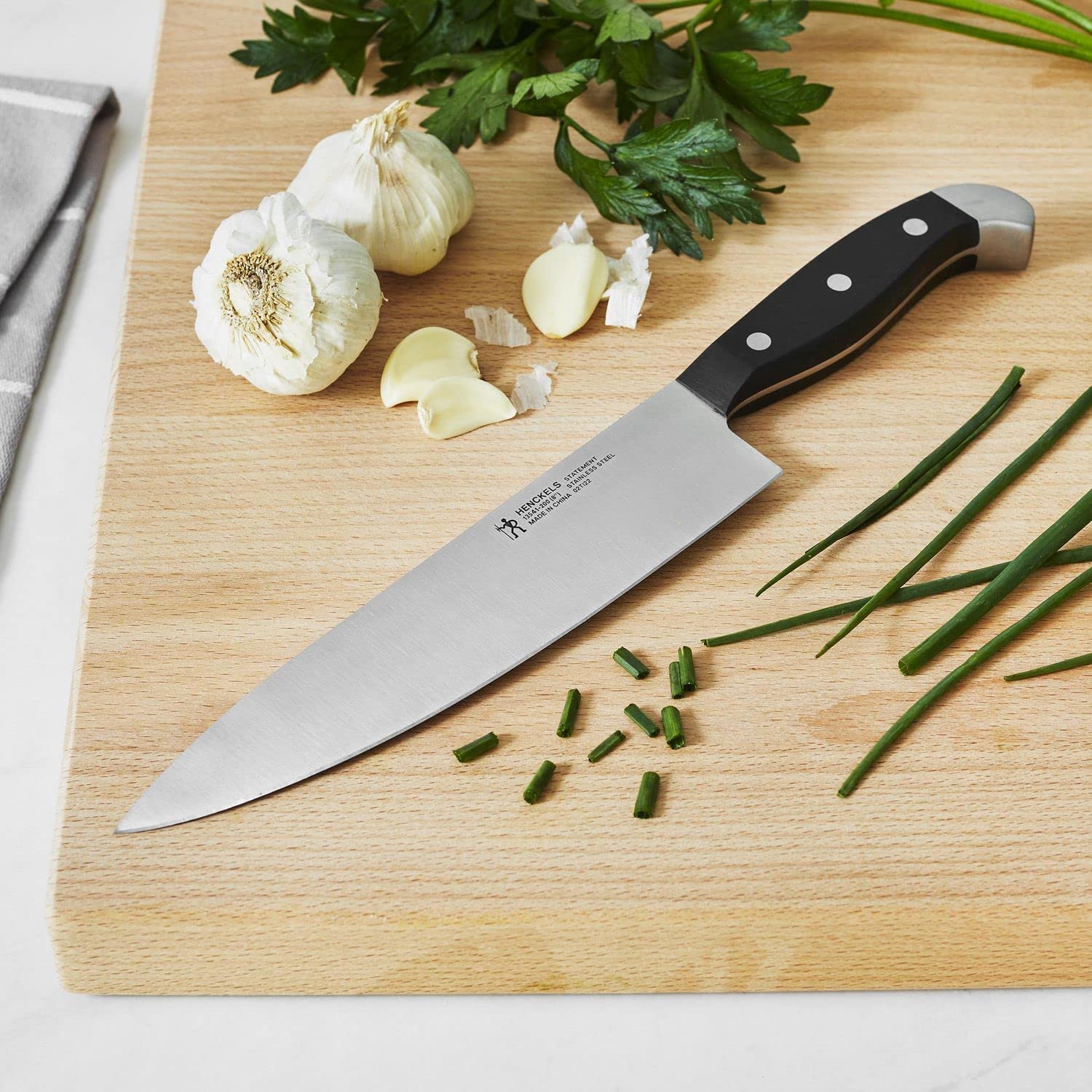 Close-up of Henckels premium 12-piece blades highlighting satin finish and edge retention.
