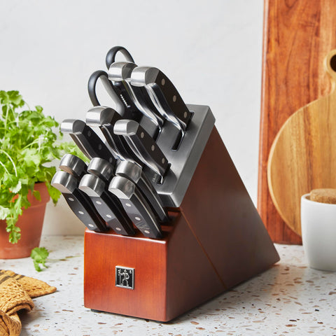 Henckels Statement set close-up highlights ergonomic triple-rivet handles for fatigue-free cutting.