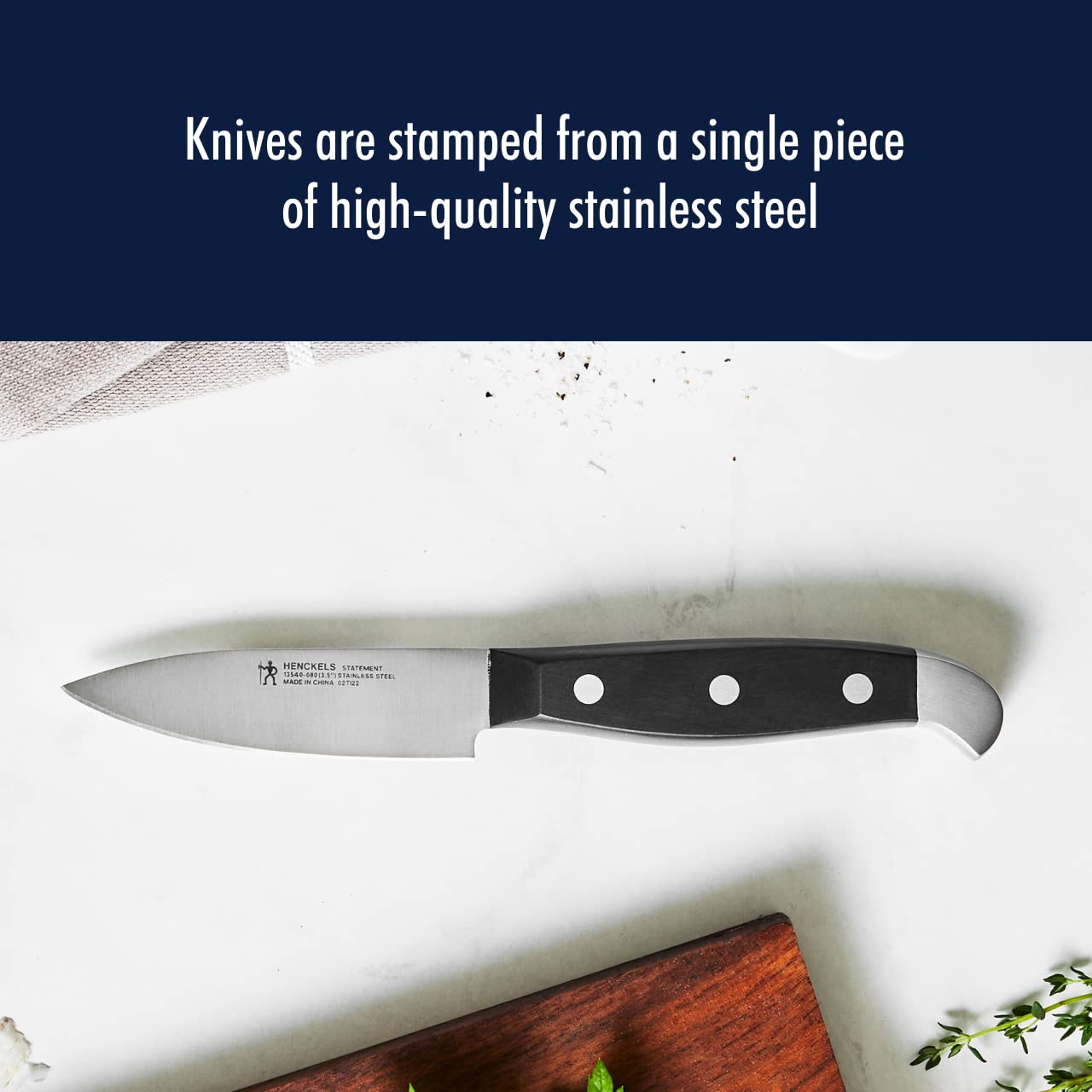 Henckels Statement paring knife handle ergonomic view for comfortable precision tasks.