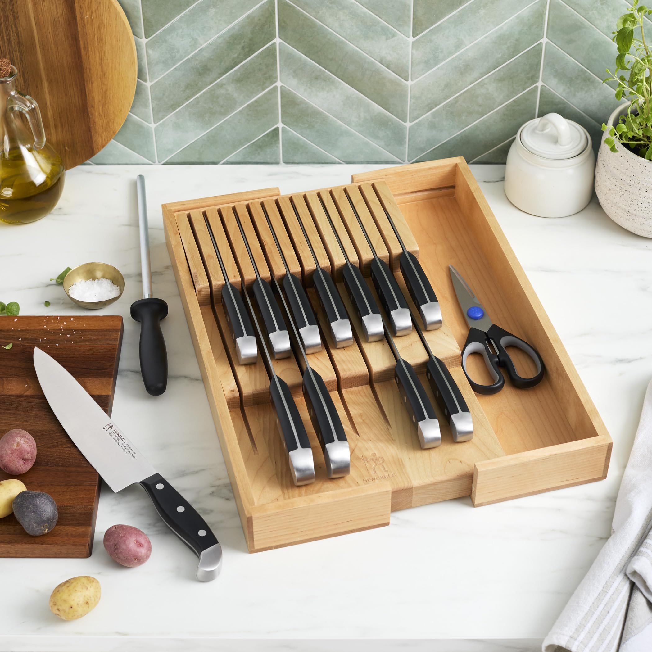 Henckels bread knife slicing crusty bread with clean, consistent cuts