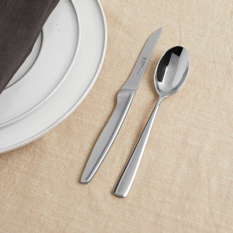 Henckels single-piece blade with satin finish for durability and precise slicing