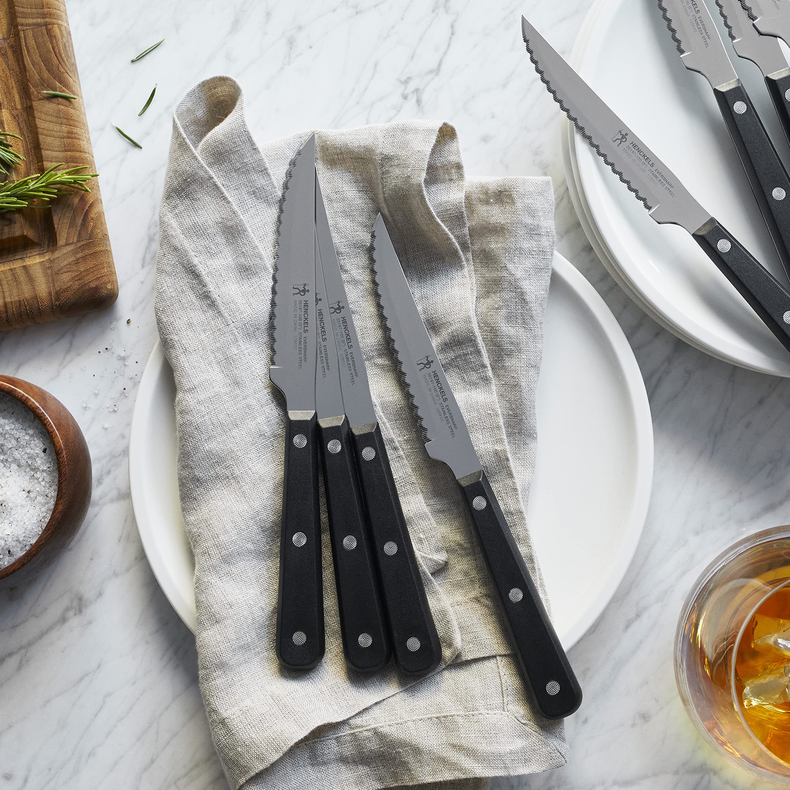 Henckels triple riveted handle close-up highlights durable balance.