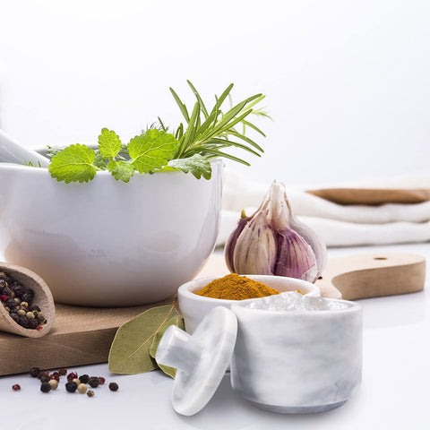 HESHIBI white marble jar for spices or jewelry on a vanity shelf.