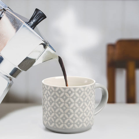 Stable metal rack design keeps mugs organized on countertop.