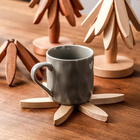 HIQUA set of four wooden trivets offers practical heat protection for meals.