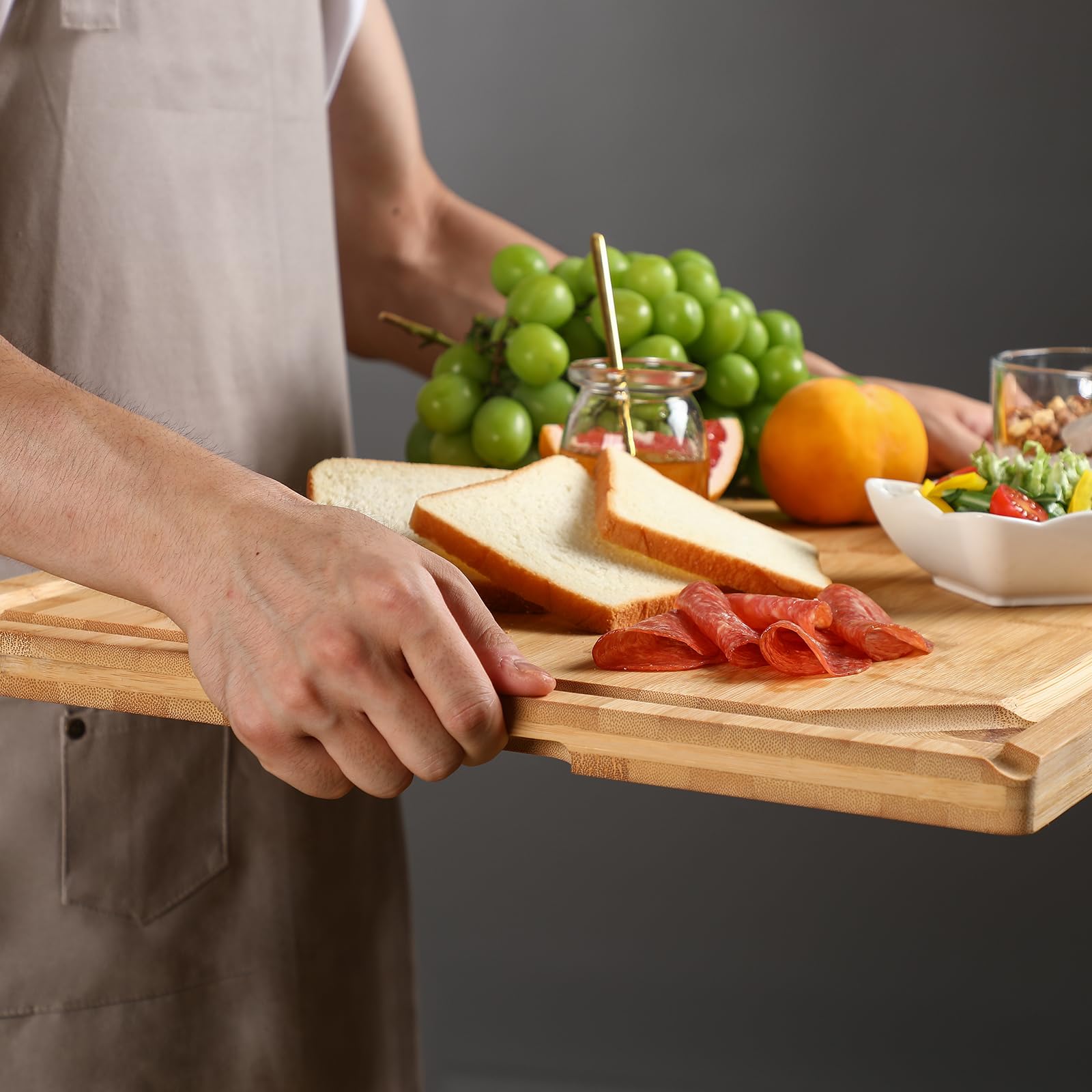 HIWARE bamboo board used as large charcuterie display for gatherings.